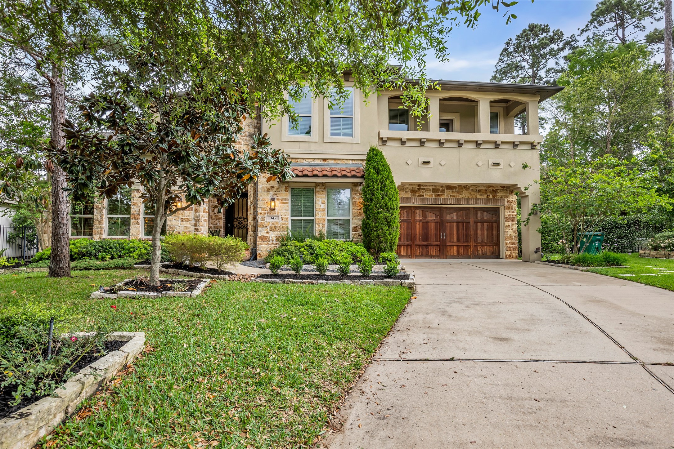 143 West Valera Ridge Place Spring, TX 77389 - Photo 5 of 50 a front view of a house with yard and green space