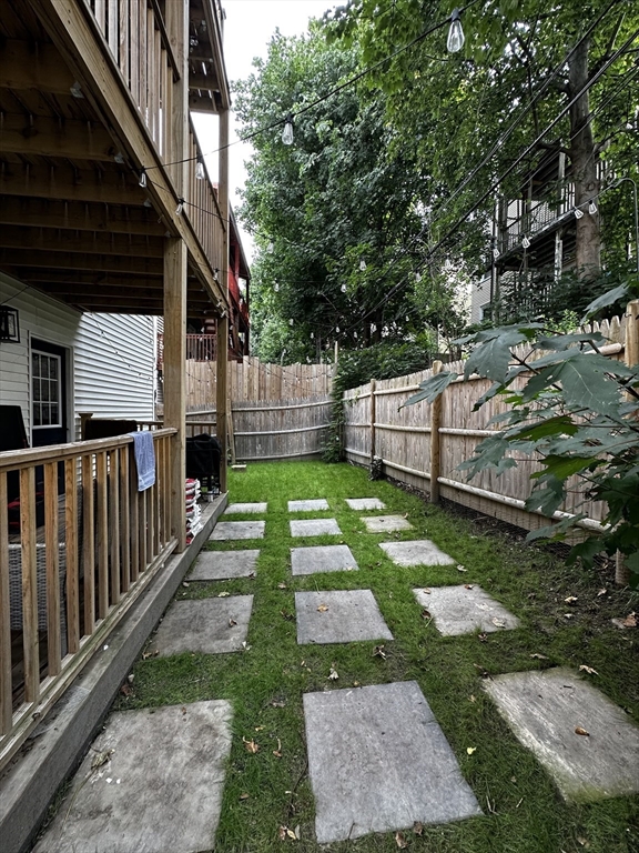 101 Draper Street, Unit 2 Boston, MA 02122 - Photo 18 of 19 a view of a backyard with a small cabin