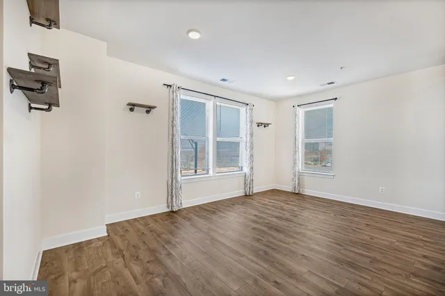 a bathroom with a sink a mirror and a toilet