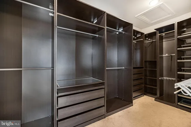 a bathroom with a shower sink and mirror