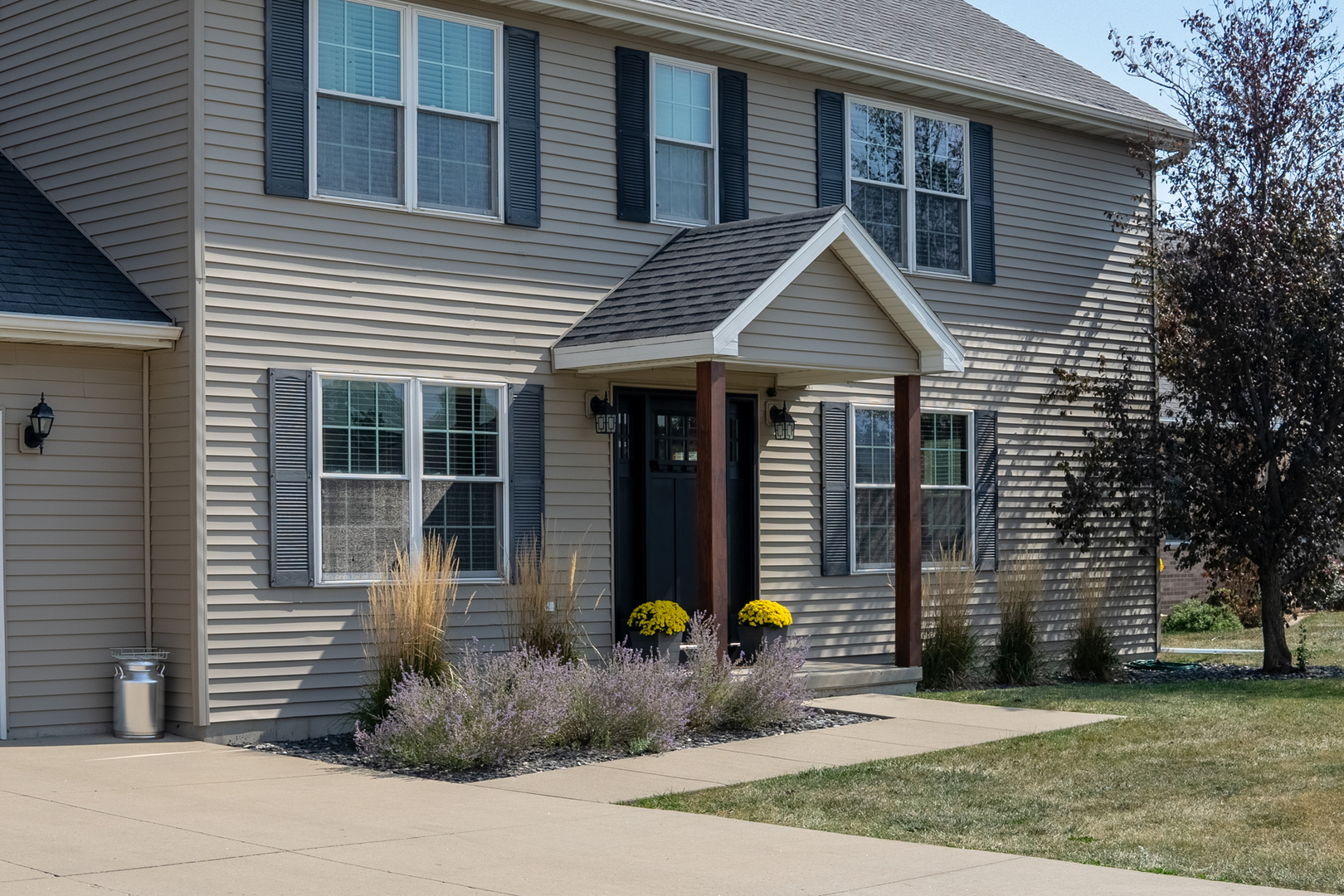 3421 Marquette Road Peru, IL 61354 - Photo 2 of 41 a front view of a house with glass windows and plants
