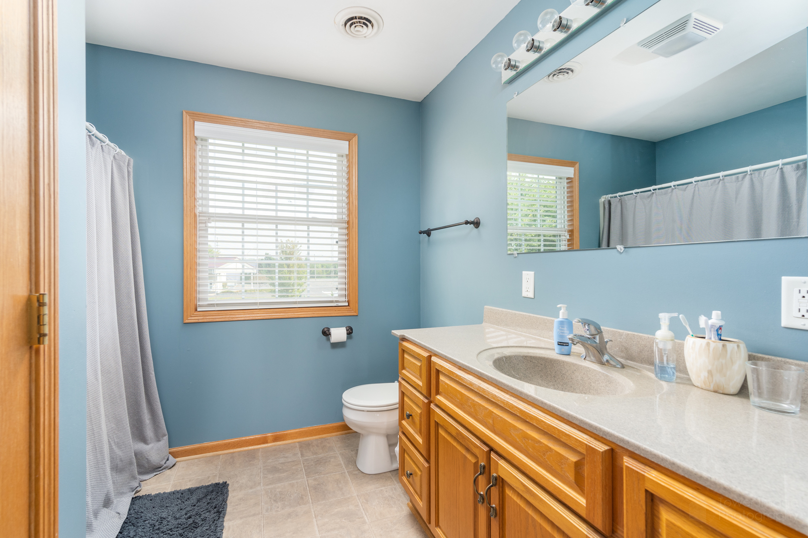 3421 Marquette Road Peru, IL 61354 - Photo 26 of 41 a bathroom with a sink and a mirror