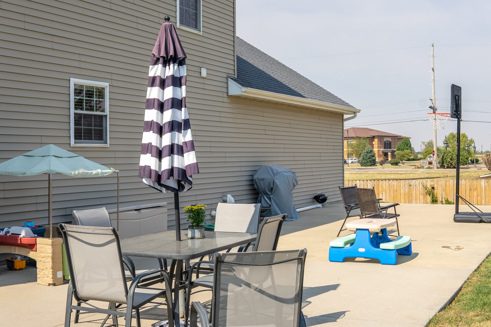 3421 Marquette Road Peru, IL 61354 - Photo 38 of 41 a table and chairs sitting in front of a house