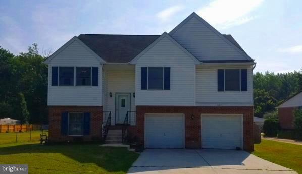 353 Back River Neck Road Baltimore, MD 21221 - Photo 1 of 23 a front view of a house with a yard