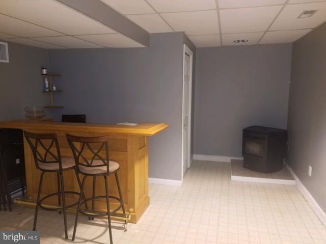 353 Back River Neck Road Baltimore, MD 21221 - Photo 20 of 23 a kitchen with stainless steel appliances kitchen island a chandelier