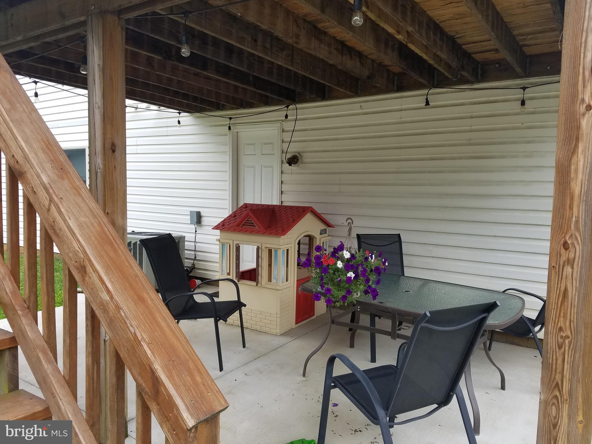 353 Back River Neck Road Baltimore, MD 21221 - Photo 23 of 23 a balcony with furniture and a potted plant