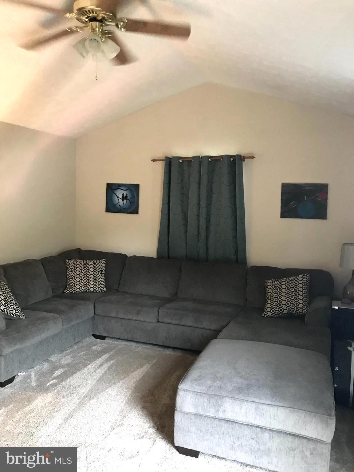 353 Back River Neck Road Baltimore, MD 21221 - Photo 6 of 23 a living room with furniture and a ceiling fan