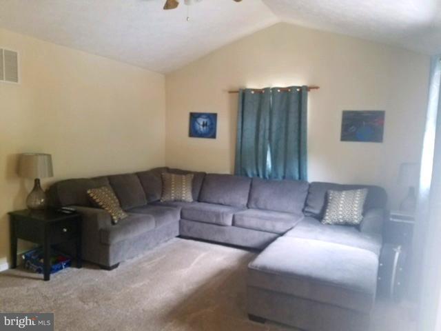 353 Back River Neck Road Baltimore, MD 21221 - Photo 7 of 23 a living room with furniture and a lamp