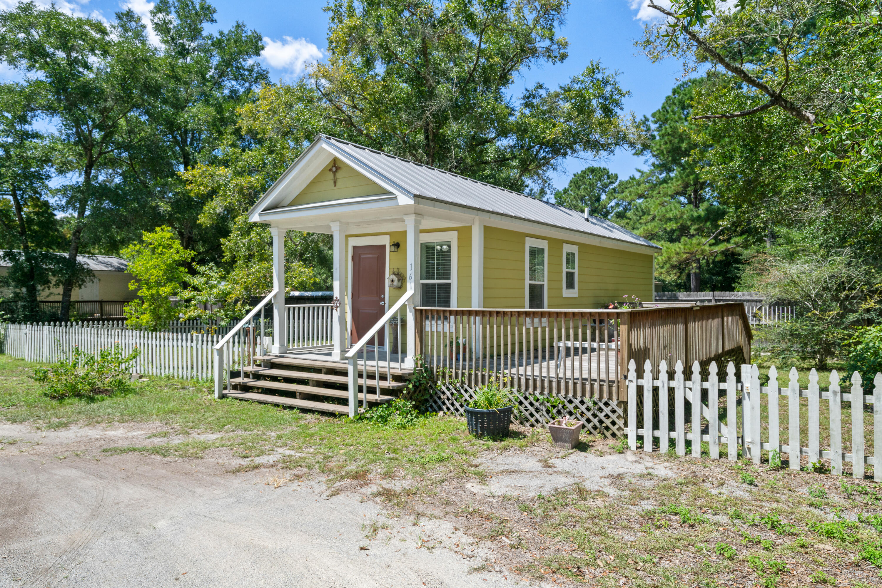 161 Caswell Branch Road Freeport, FL 32439 - Photo 2 of 15 a view of a house with a small yard and wooden fence
