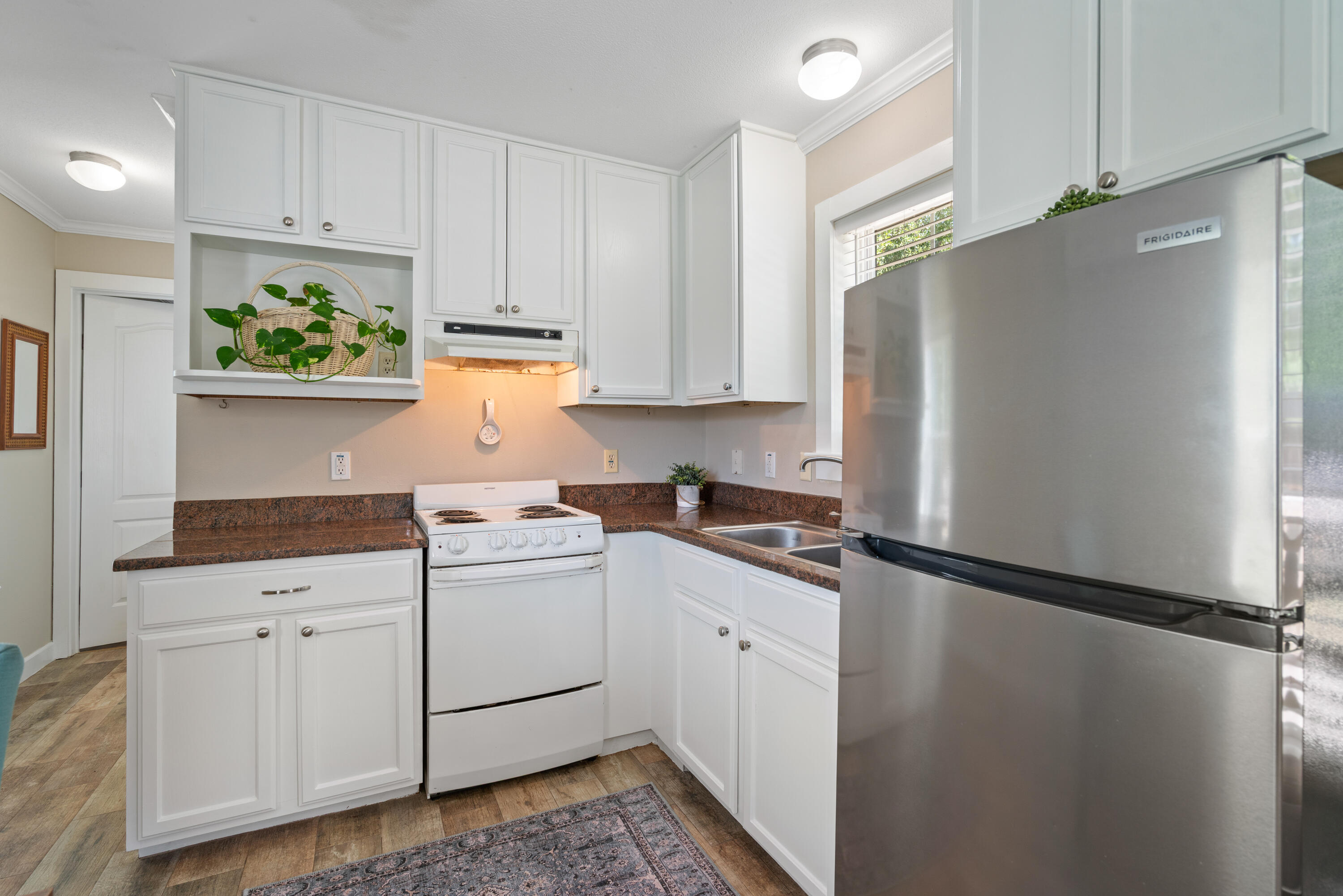 161 Caswell Branch Road Freeport, FL 32439 - Photo 8 of 15 a kitchen with a white cabinets and white appliances
