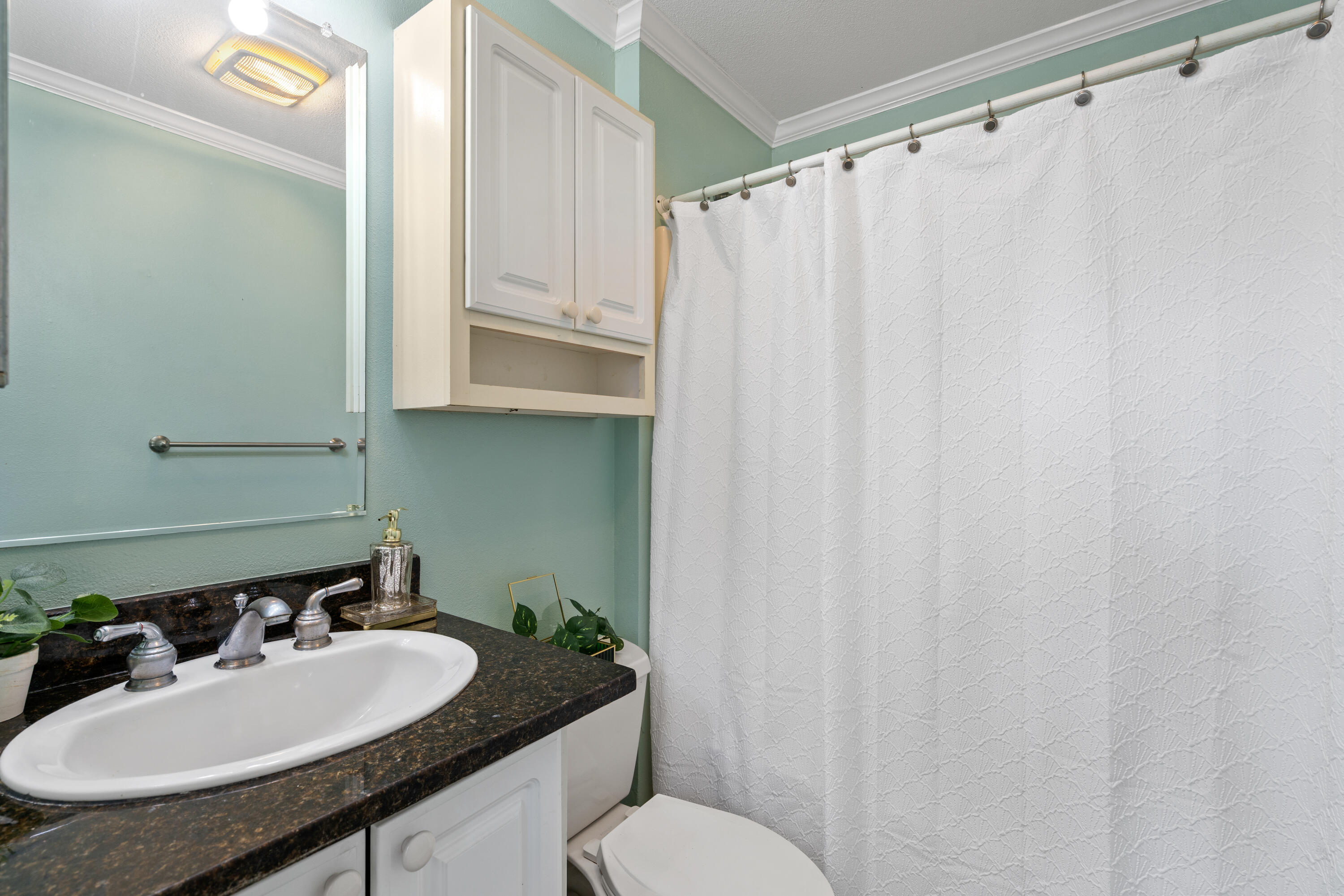 161 Caswell Branch Road Freeport, FL 32439 - Photo 10 of 15 a bathroom with a sink and a mirror