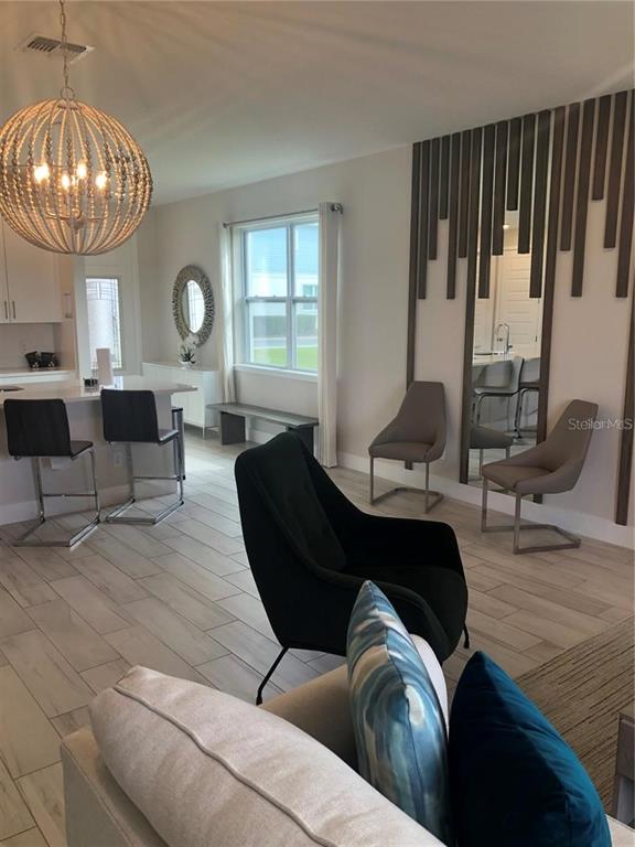 820 Driving Range Court Reunion, FL 34747 - Photo 14 of 45 a living room with furniture and a large window