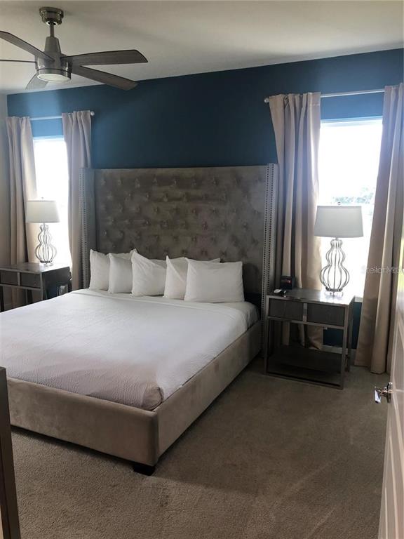 820 Driving Range Court Reunion, FL 34747 - Photo 20 of 45 a bedroom with a bed and a window