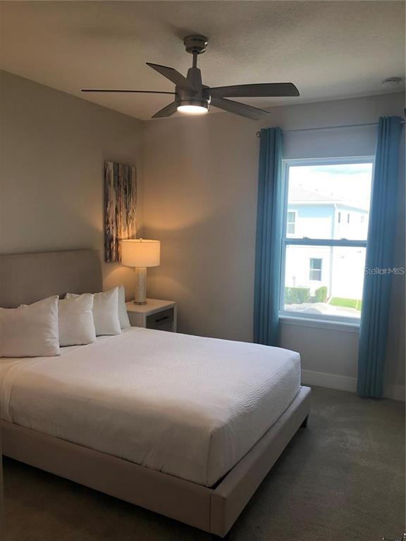 820 Driving Range Court Reunion, FL 34747 - Photo 26 of 45 a bedroom with a bed and a window