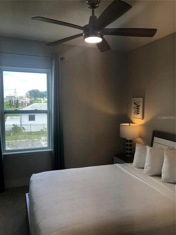 820 Driving Range Court Reunion, FL 34747 - Photo 29 of 45 a bedroom with a bed and window