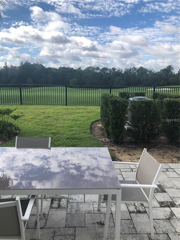 820 Driving Range Court Reunion, FL 34747 - Photo 36 of 45 a view of a garden with a bench in a garden