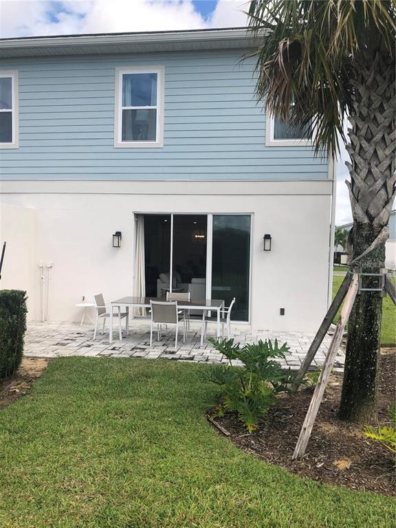 820 Driving Range Court Reunion, FL 34747 - Photo 38 of 45 a front view of house with yard and seating