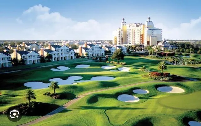 a view of a golf course with an outdoor space