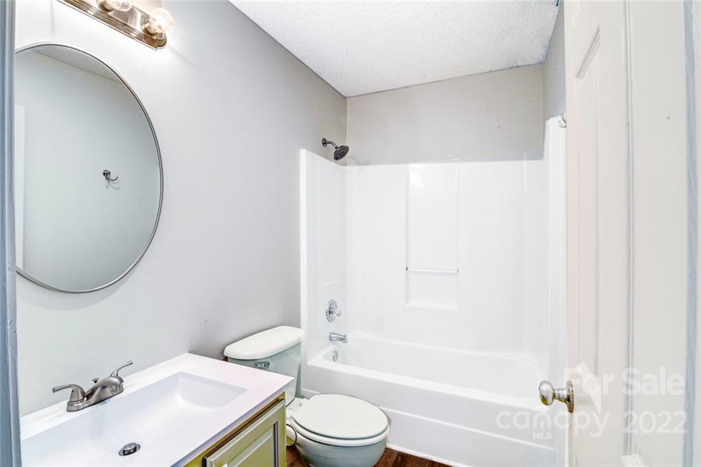 1022 Piney Church Road Concord, NC 28025 - Photo 13 of 16 a bathroom with a sink toilet and shower