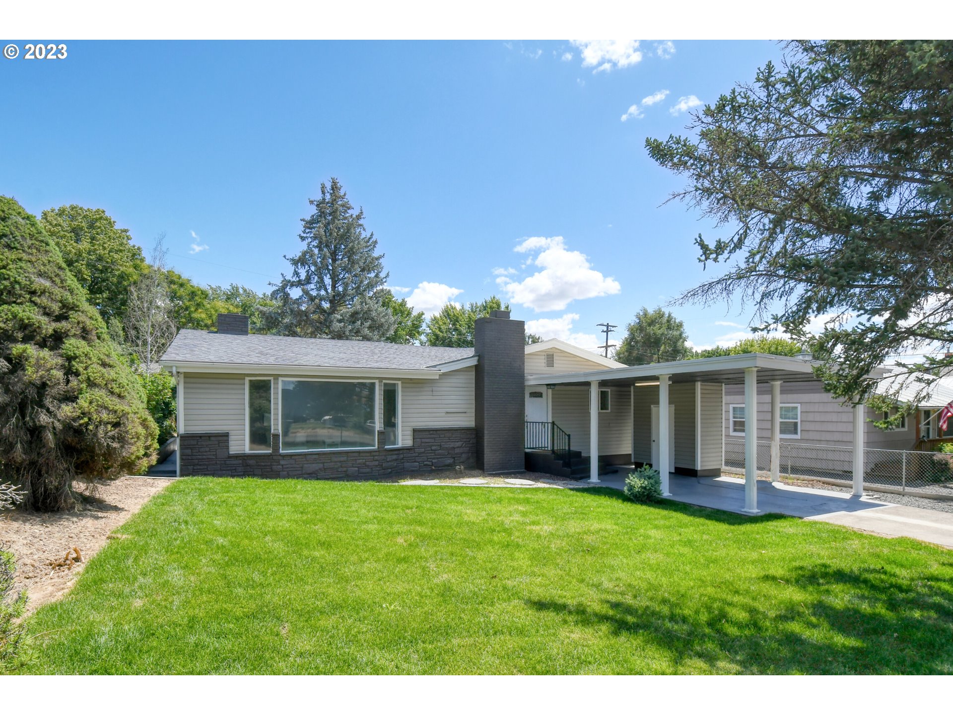 3012 Southwest Isaac Avenue Pendleton, OR 97801 - Photo 1 of 30 a view of a house with a yard and a large tree