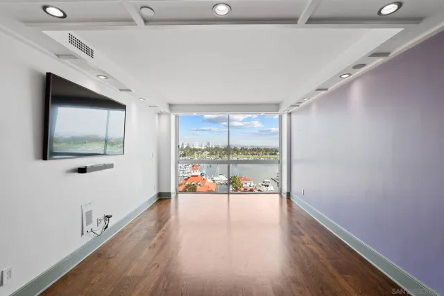 a kitchen with stainless steel appliances a large counter top a stove and a refrigerator