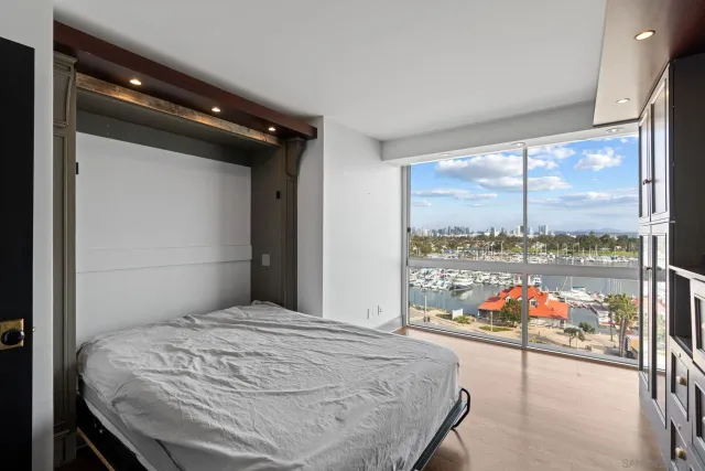 a bathroom with a glass shower door and a sink