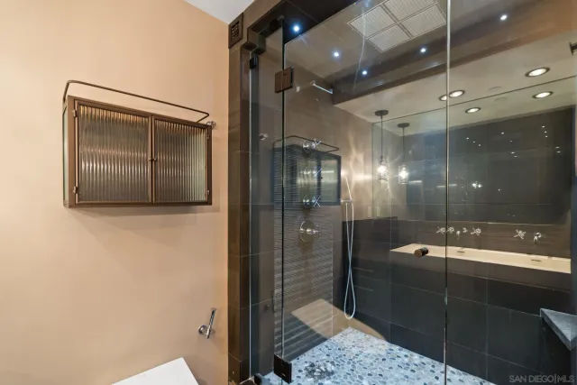 a bathroom with a sink a mirror and bathtub