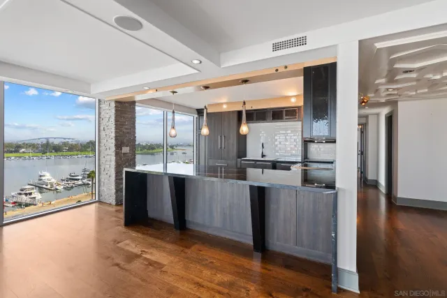 a view of an entryway with wooden floor and windows