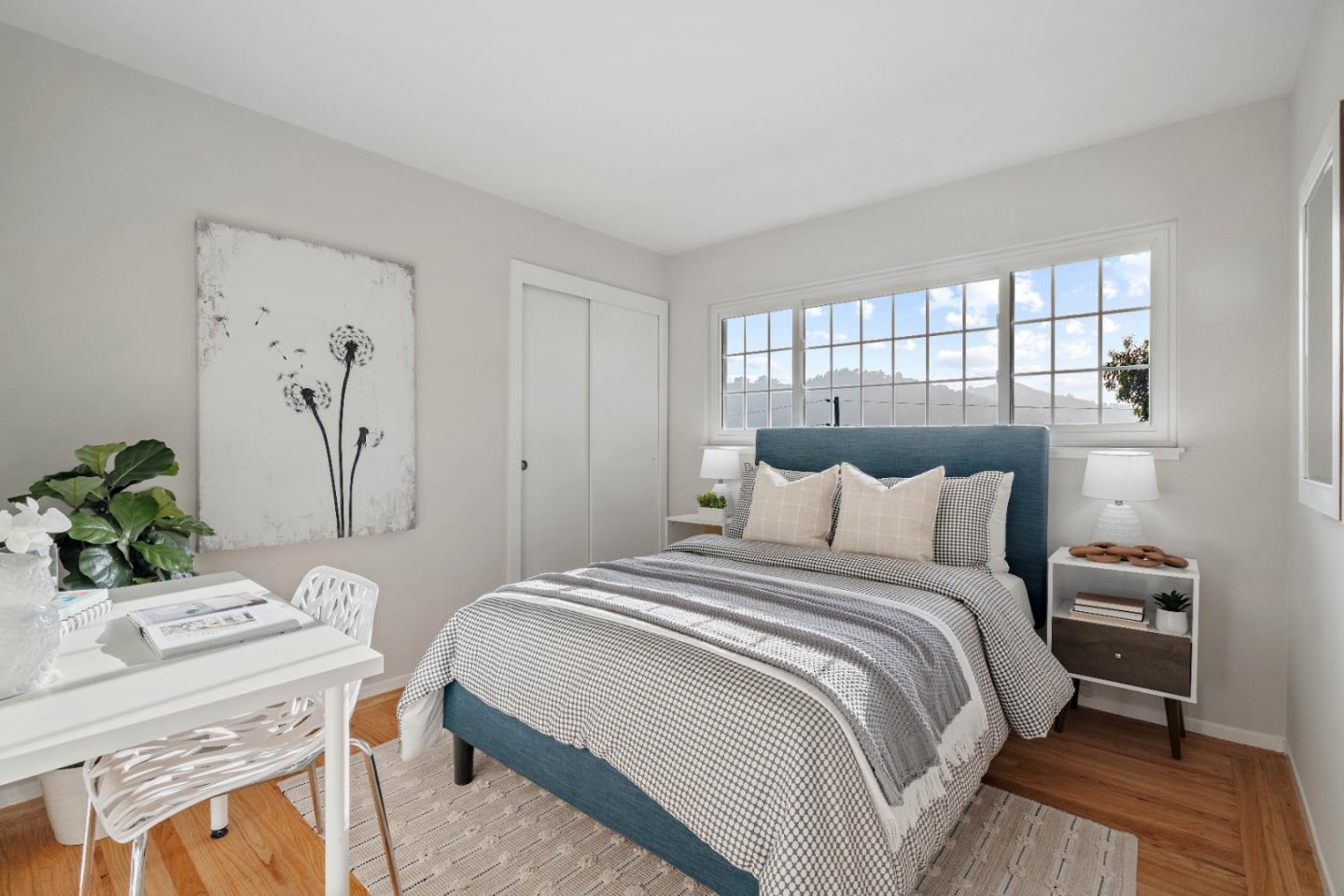 1212 Seville Drive Pacifica, CA 94044 - Photo 14 of 37 a bedroom with a bed and a table