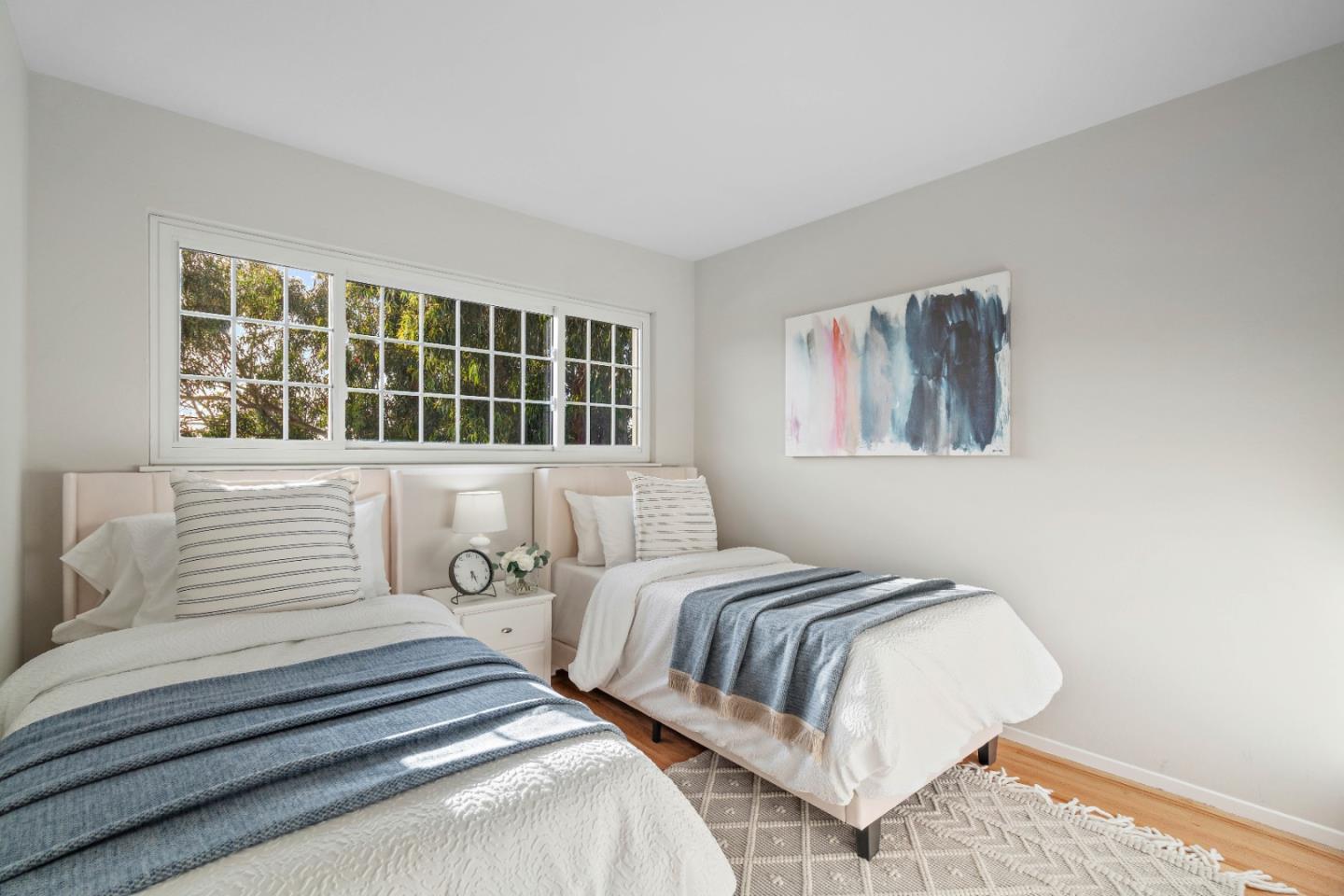 1212 Seville Drive Pacifica, CA 94044 - Photo 16 of 37 a bedroom with two beds and a window