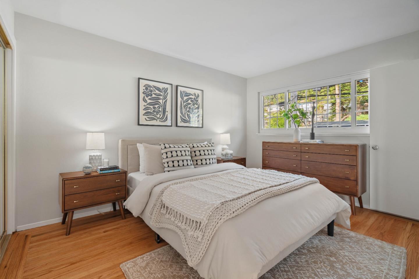 1212 Seville Drive Pacifica, CA 94044 - Photo 17 of 37 a bedroom with a bed and a night stand