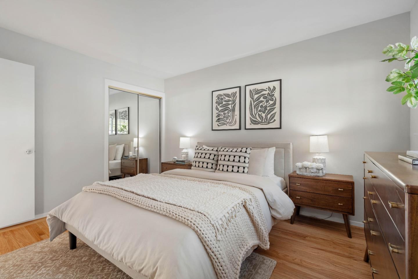 1212 Seville Drive Pacifica, CA 94044 - Photo 18 of 37 a bedroom with a bed and wooden floor