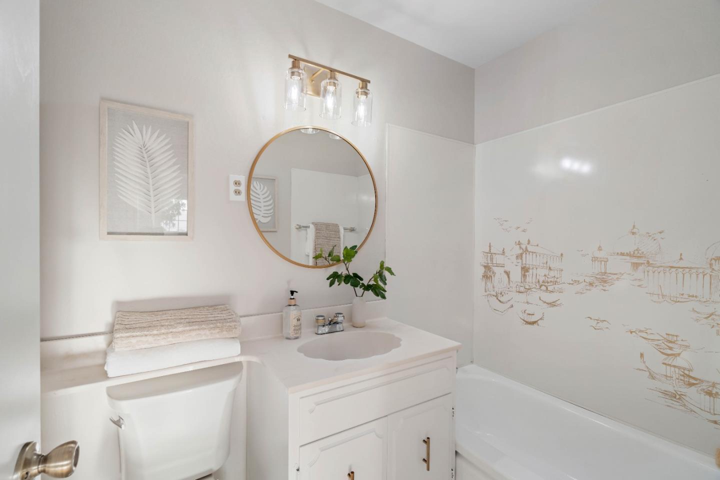 1212 Seville Drive Pacifica, CA 94044 - Photo 20 of 37 a bathroom with a sink a toilet and a mirror