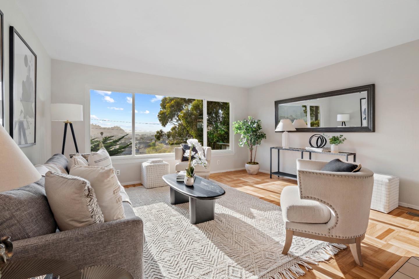 1212 Seville Drive Pacifica, CA 94044 - Photo 2 of 37 a living room with furniture and a large window