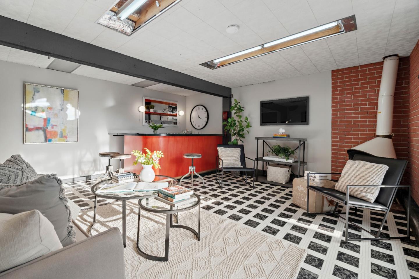 1212 Seville Drive Pacifica, CA 94044 - Photo 21 of 37 a living room with furniture a flat screen tv and kitchen view