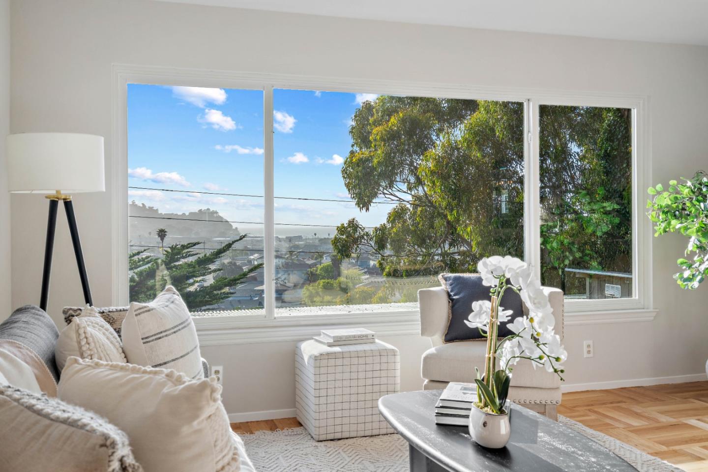 1212 Seville Drive Pacifica, CA 94044 - Photo 6 of 37 a living room with furniture and a floor to ceiling window