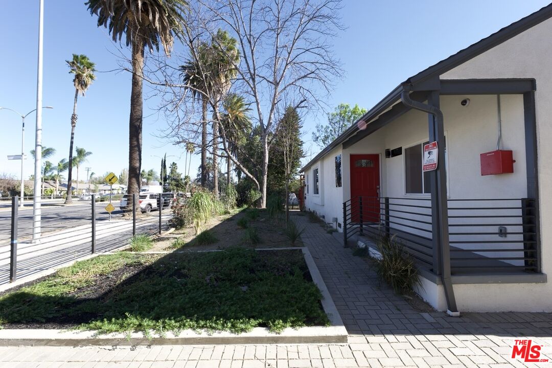 17610 Sherman Way, Unit 3 Van Nuys, CA 91406 - Photo 13 of 19 a view of a house with a yard