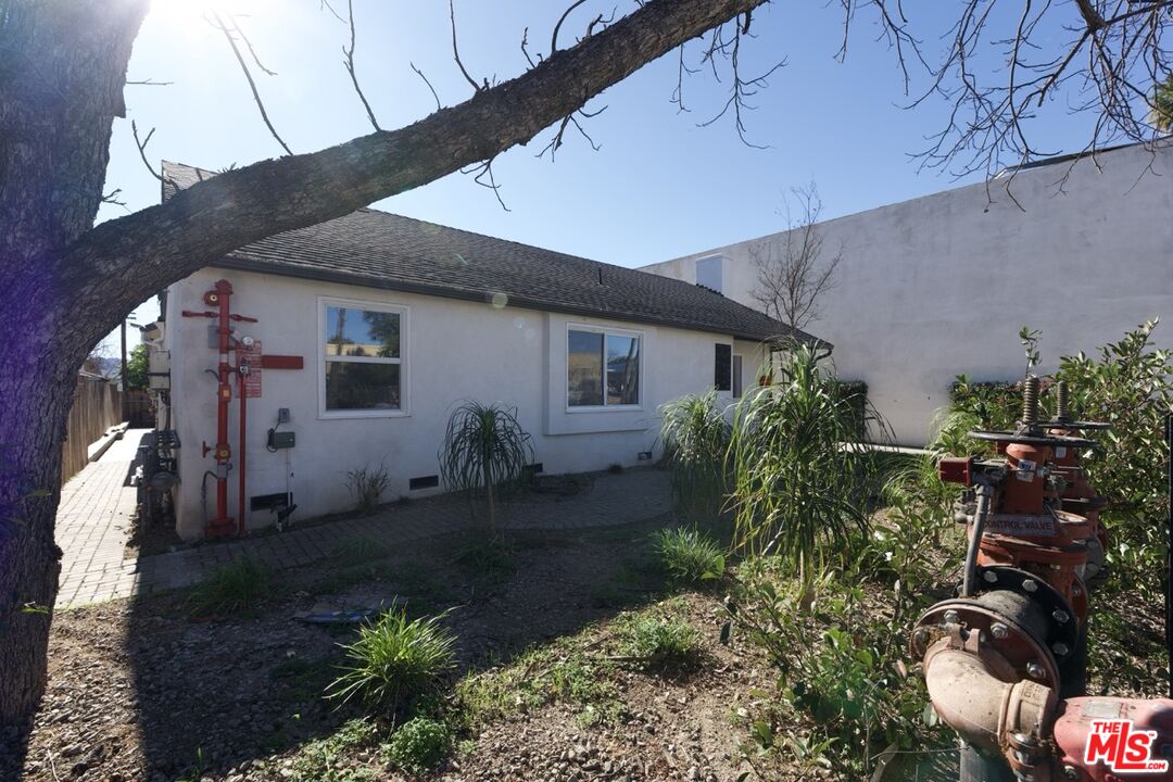 17610 Sherman Way, Unit 3 Van Nuys, CA 91406 - Photo 14 of 19 a house view with a backyard space