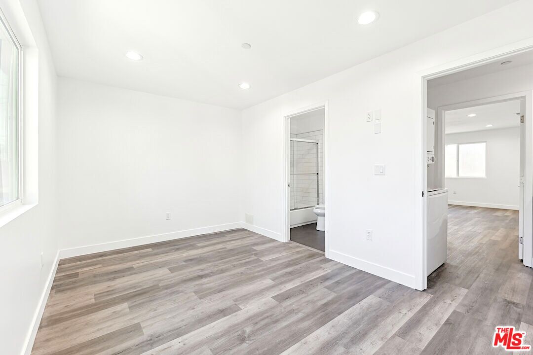 17610 Sherman Way, Unit 3 Van Nuys, CA 91406 - Photo 8 of 19 a view of empty room with wooden floor