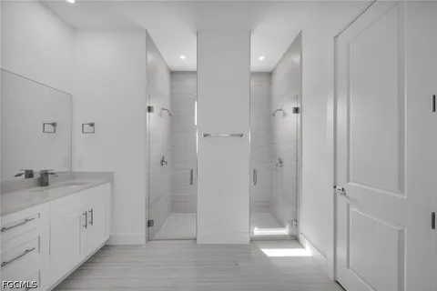 a bathroom with a shower a toilet and a sink