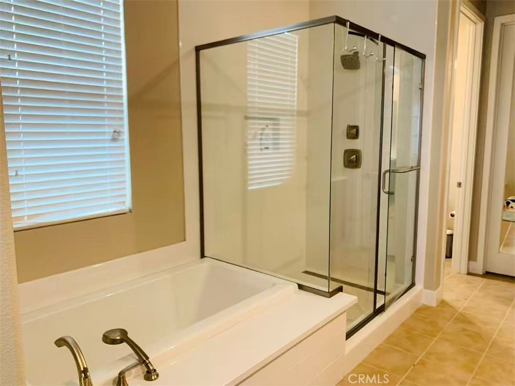 170 Scale Irvine, CA 92618 - Photo 9 of 9 a bathroom with a tub and shower