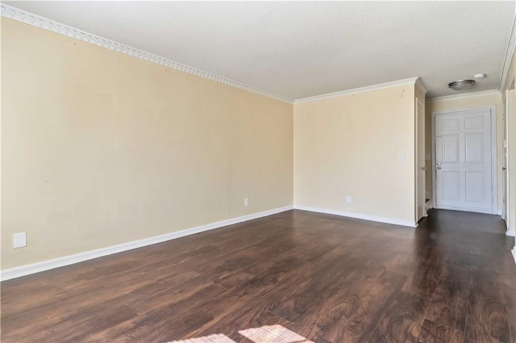 119 Plantation Circle Clarkston, GA 30021 - Photo 4 of 25 a view of an empty room with wooden floor