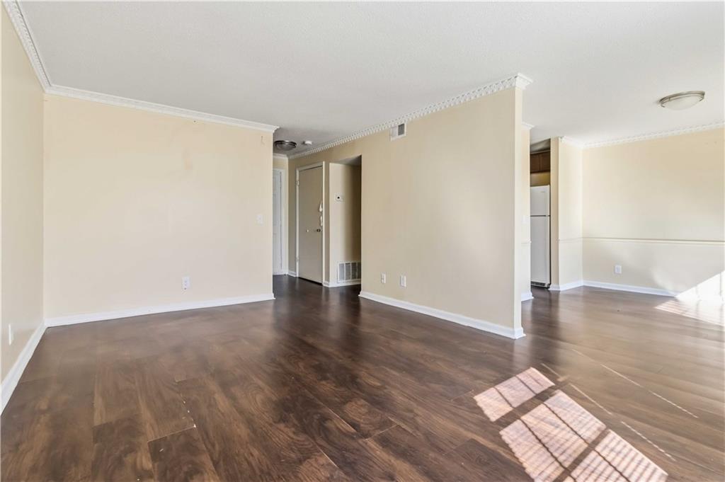 119 Plantation Circle Clarkston, GA 30021 - Photo 5 of 25 a view of an empty room and wooden floor