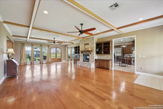 a view of a hall with wooden floor