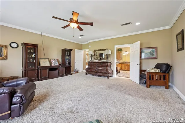 a living room with furniture and a dining table