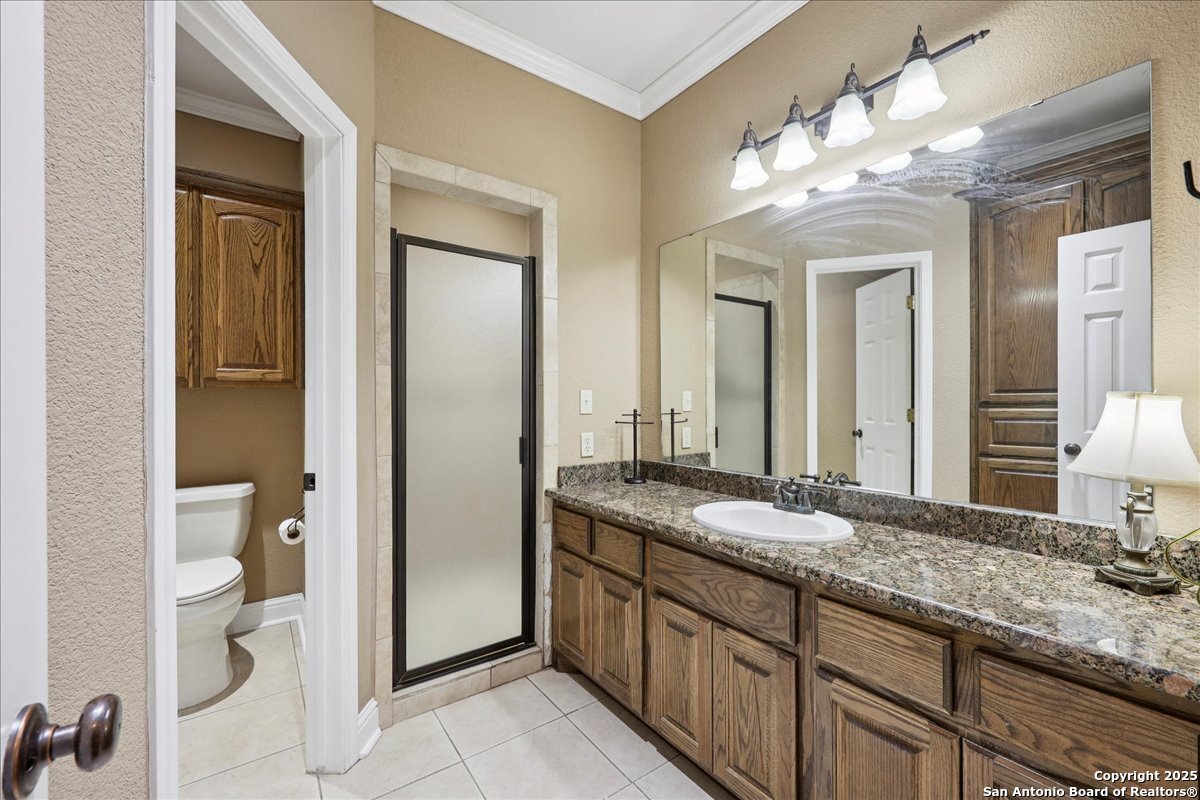 6900 Meyers Road Orange, TX 77632 - Photo 38 of 49 a bathroom with a granite countertop sink a large mirror and a shower