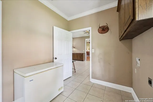 a view of an empty room with a door