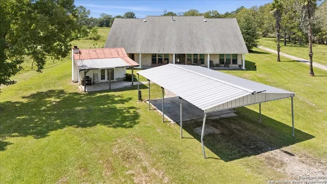 an aerial view of a house with swimming pool