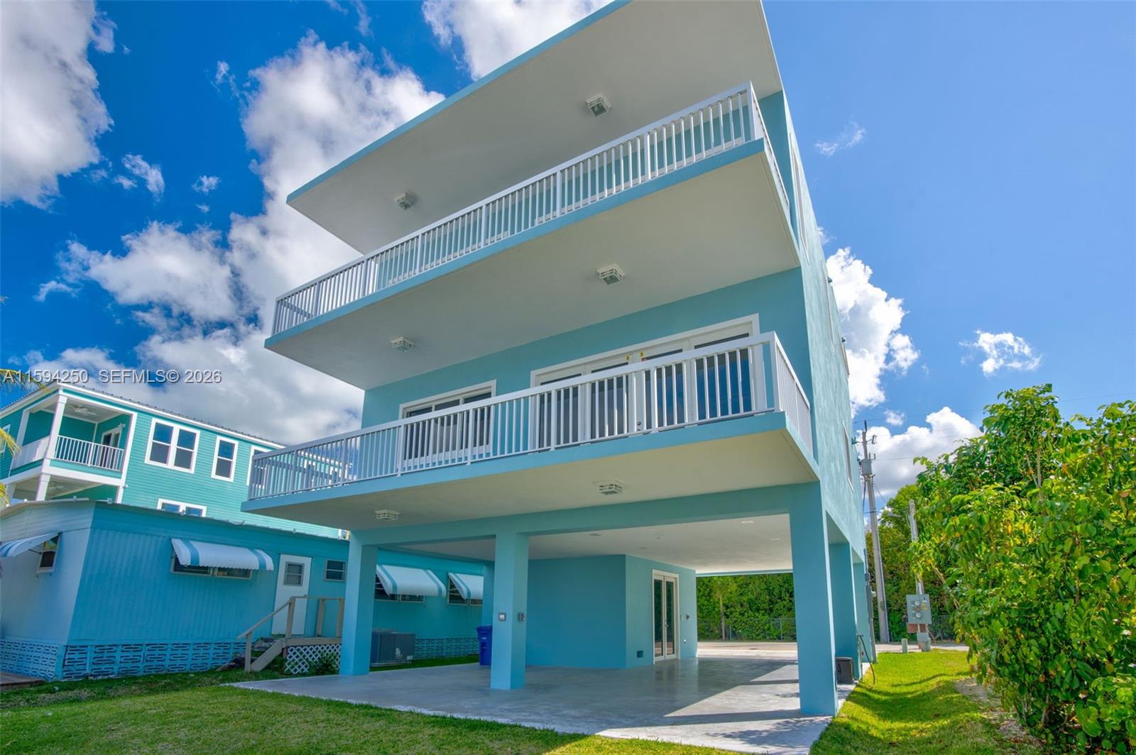 84 Coral Way Key Largo, FL 33037 - Photo 41 of 55 a view of a building with a big yard