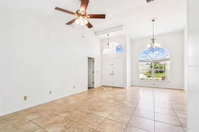 a bathroom with a granite countertop sink and a window